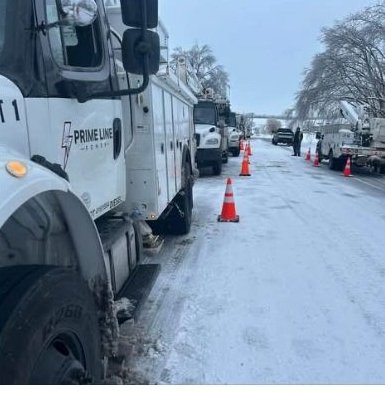 Prime Line Power truck staged on a snowy street